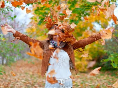 happy-woman-throws-autumn-leaves (1)